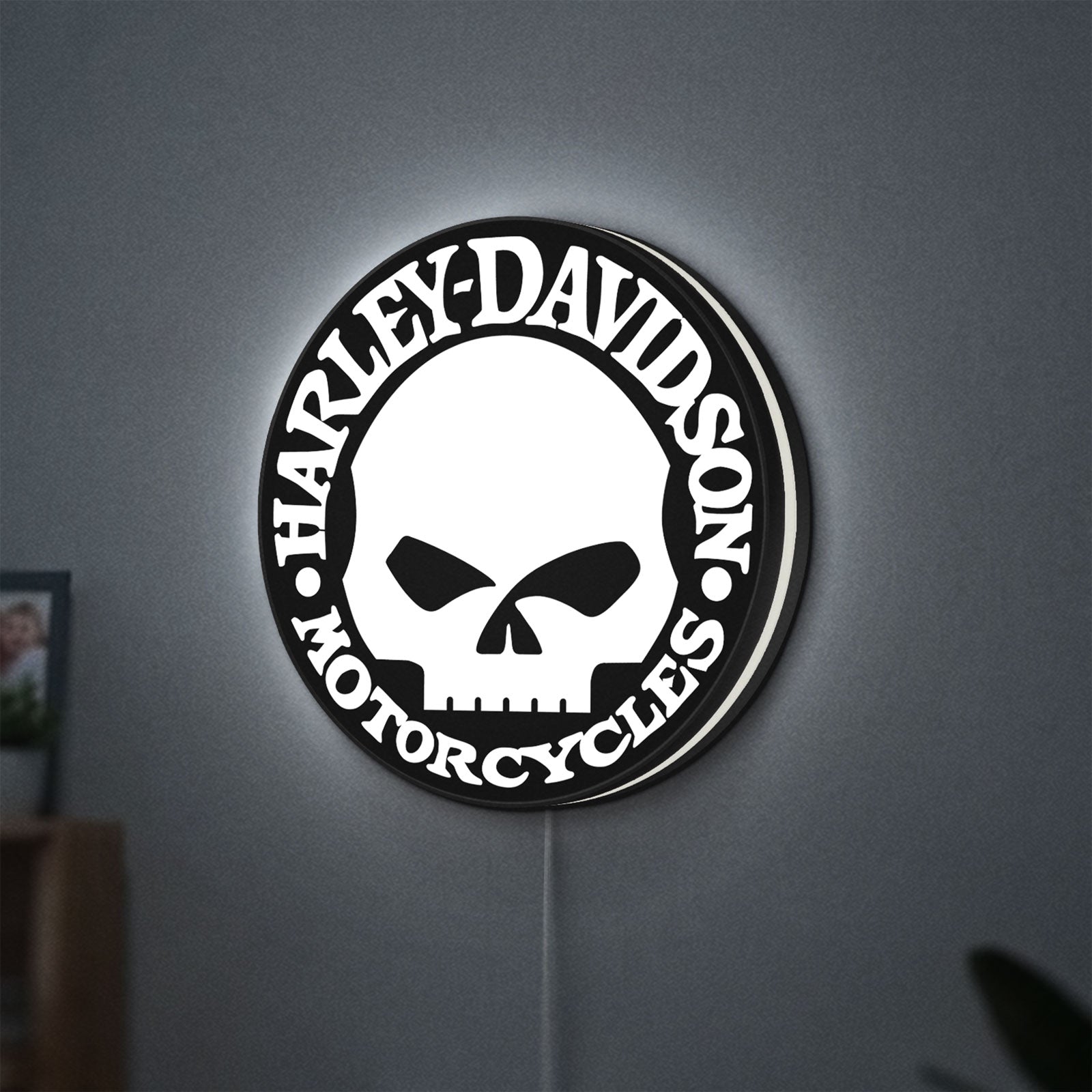 Harley Davidson Skull LED lightbox hanging on a wall with white glow