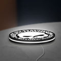 Harley Davidson Skull LED lightbox lying flat on a desk with white glow