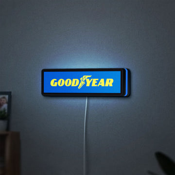Goodyear LED lightbox hanging on a wall with blue glow