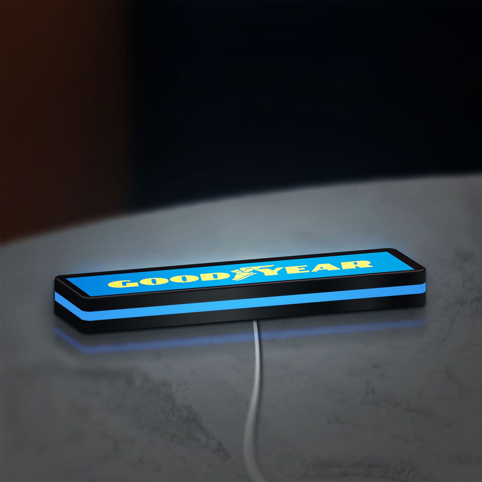 Goodyear LED lightbox lying flat on a desk with blue glow