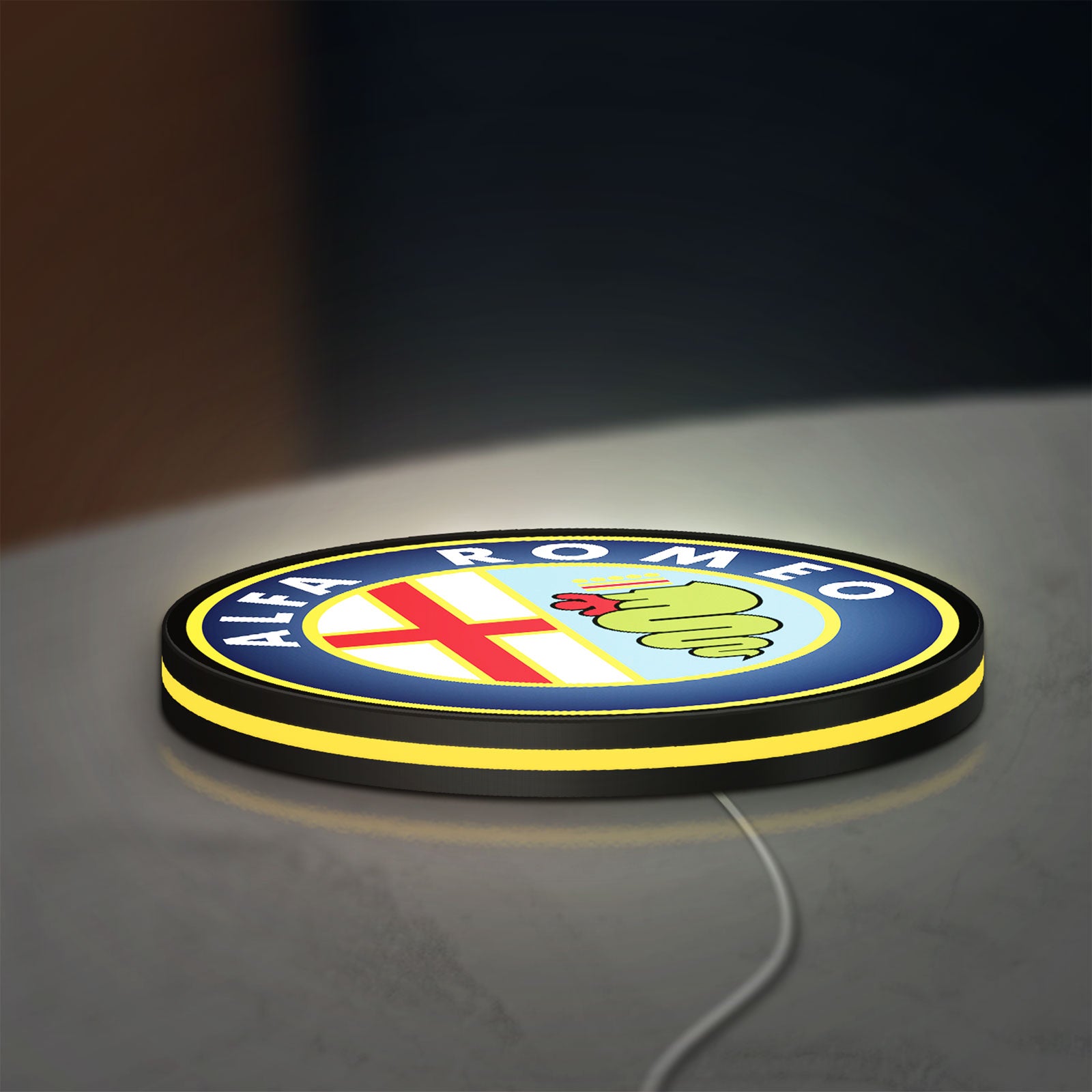 Alfa Romeo LED lightbox lying flat on a desk with yellow glow