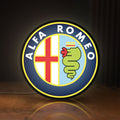 Front view of Alfa Romeo LED lightbox sign glowing on a wooden desk