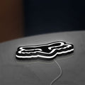 Fox Head LED lightbox lying flat on a desk with white glow