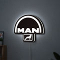 MAN Trucks LED lightbox hanging on a wall with white glow