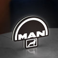 MAN Trucks LED lightbox standing on a desk from an angled side view with white glow