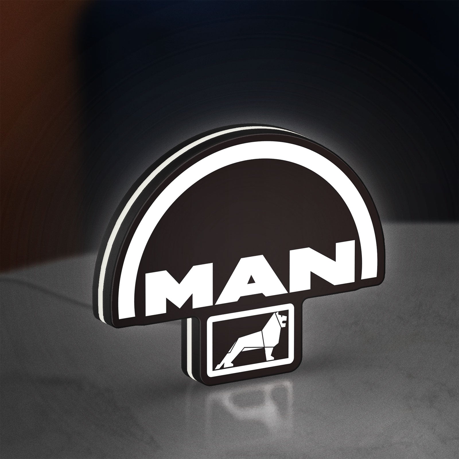 MAN Trucks LED lightbox standing on a desk from an angled side view with white glow