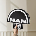 Unlit MAN Trucks LED lightbox held by hand to show size and details
