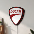 Unlit Ducati LED lightbox mounted on a wall in daylight