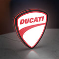 Ducati LED lightbox standing on a desk from an angled side view with red glow