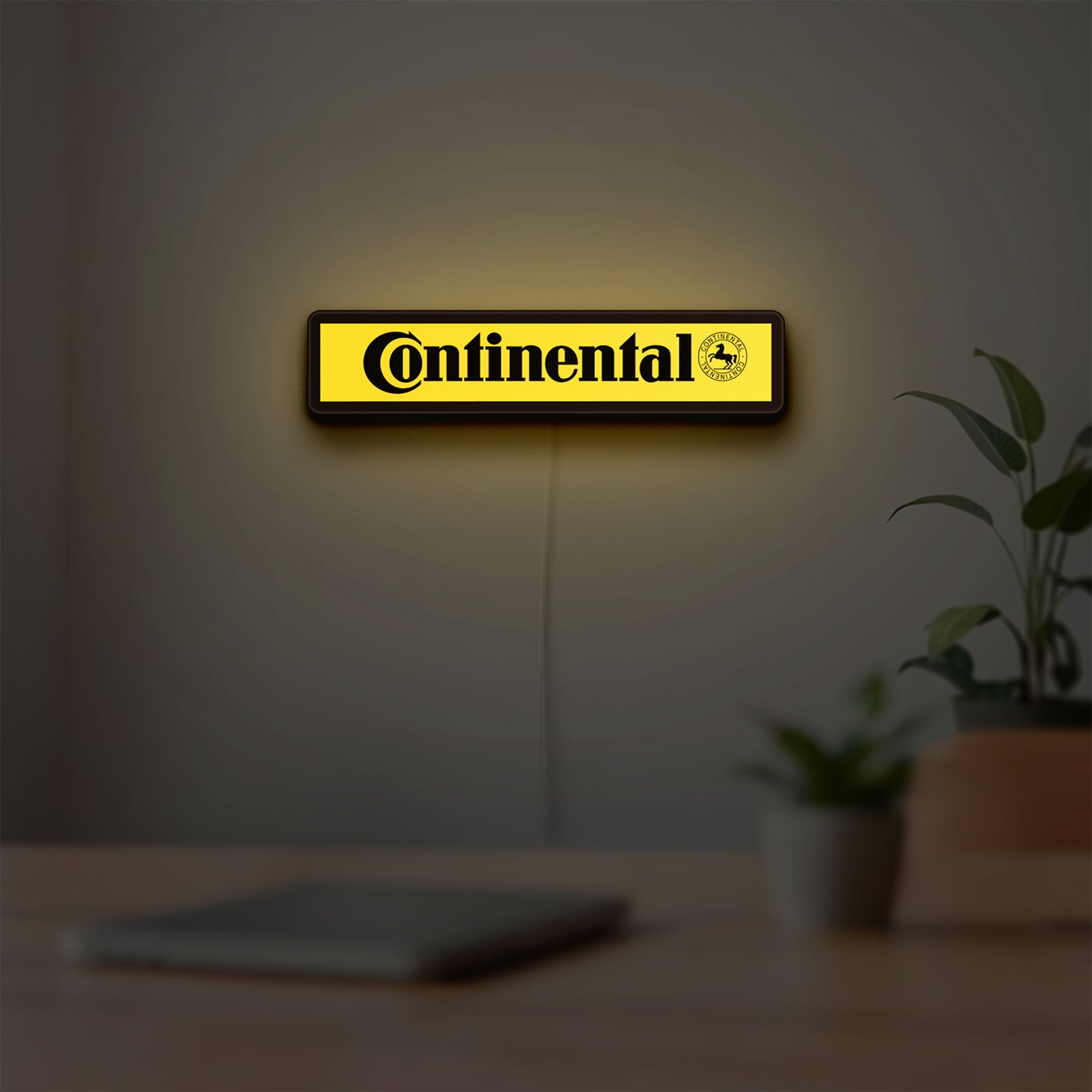 Continental LED lightbox hanging on a room wall with soft yellow light