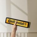 Unlit Continental LED lightbox held by hand to show size and details