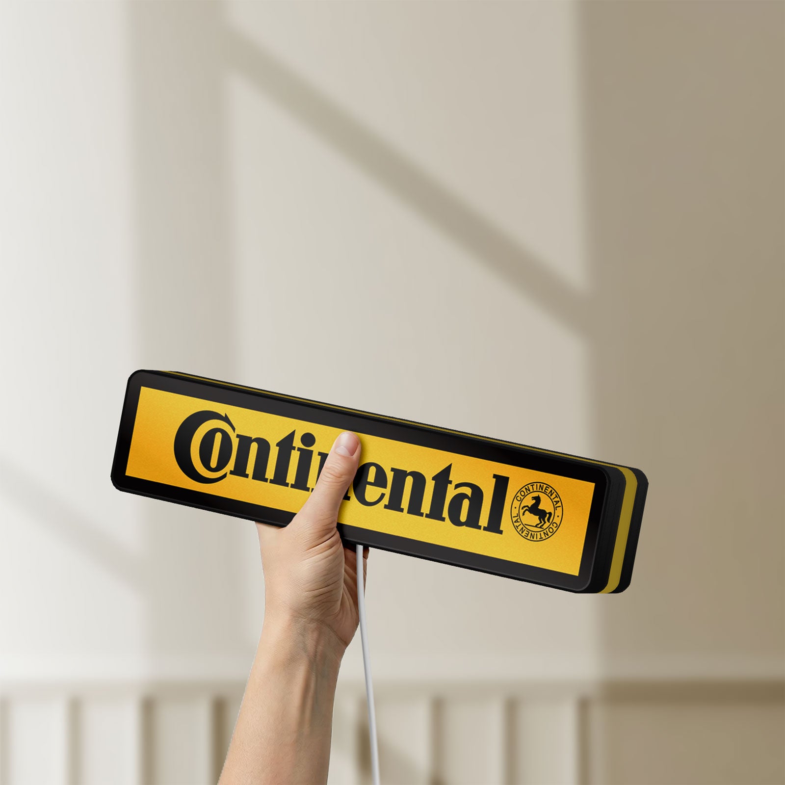 Unlit Continental LED lightbox held by hand to show size and details