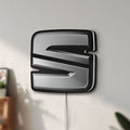 Unlit Seat LED lightbox mounted on a wall in daylight