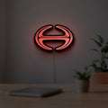 Hino Diesel Trucks LED lightbox hanging on a room wall with soft red light