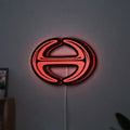 Hino Diesel Trucks LED lightbox hanging on a wall with red glow