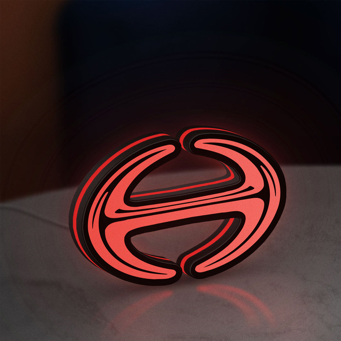 Hino Diesel Trucks LED lightbox hanging on a wall with red glow