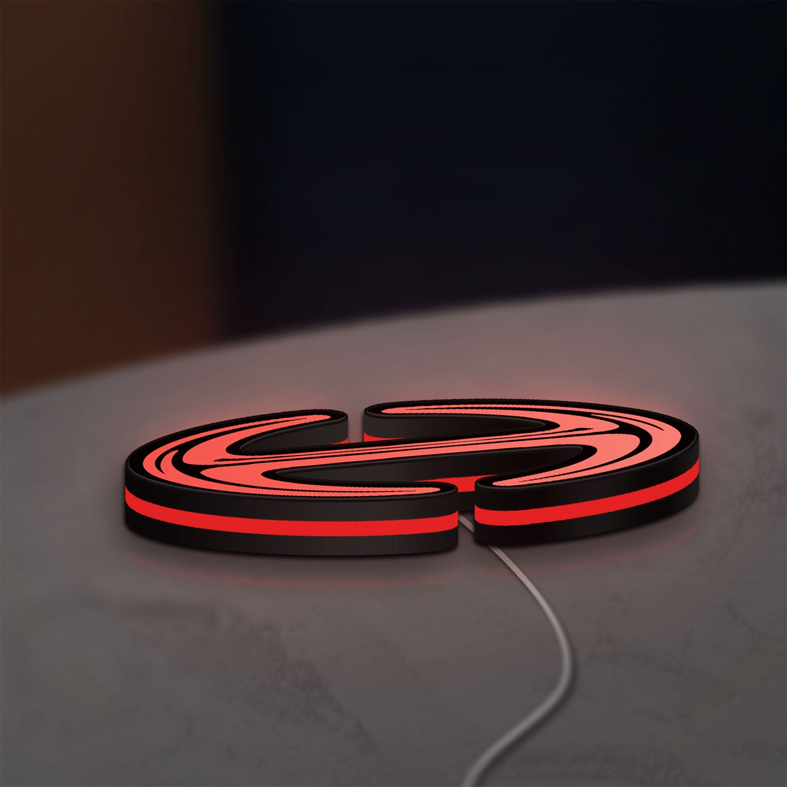 Hino Diesel Trucks LED lightbox lying flat on a desk with red glow