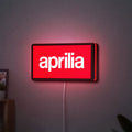 Aprilia LED lightbox hanging on a wall with red glow