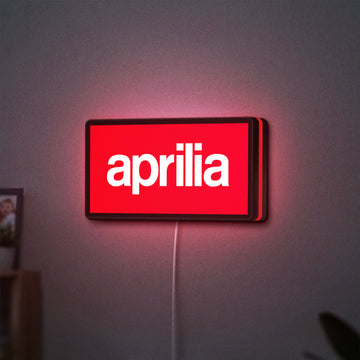 Aprilia LED lightbox hanging on a wall with red glow
