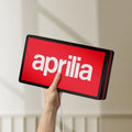 Unlit Aprilia LED lightbox held by hand to show size and details