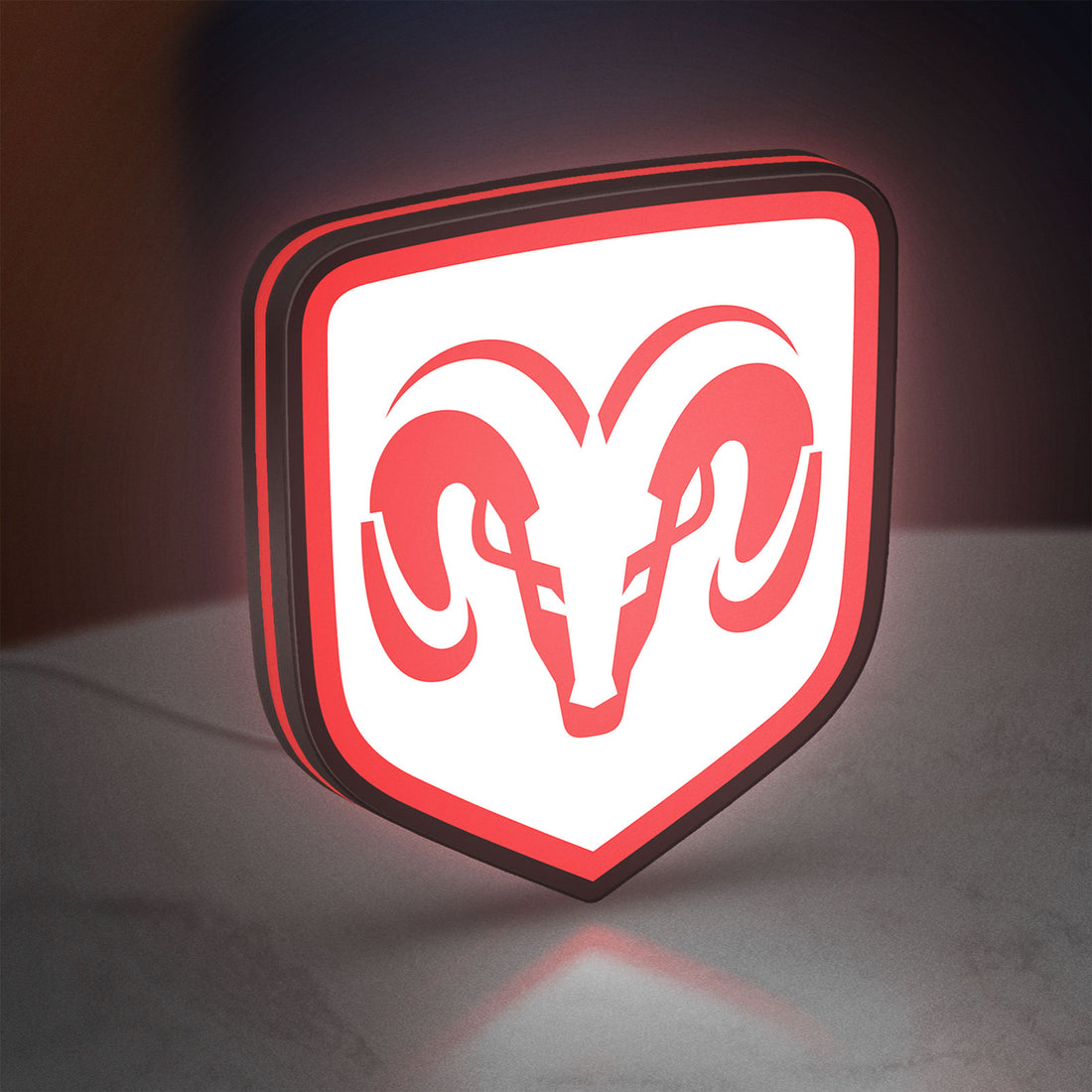 Dodge LED lightbox hanging on a wall with red glow