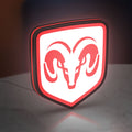 Dodge LED lightbox standing on a desk from an angled side view with red glow