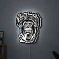 Gas Monkey Garage LED lightbox hanging on a wall with white glow
