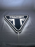 Triumph Motorcycles LED Sign (30cm) - Illuminated flat lay angled view, perfect for garage and man cave decor