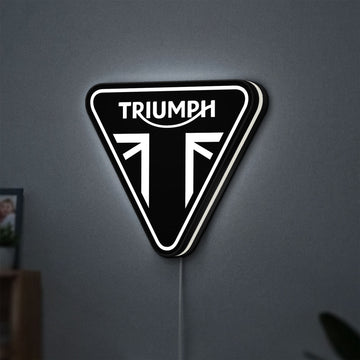 Triumph Motorcycles LED lightbox hanging on a wall with white glow