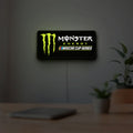 Monster Energy NASCAR Cup Series LED lightbox hanging on a room wall with soft green light