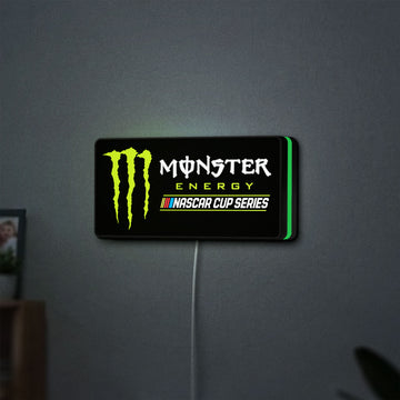 Monster Energy NASCAR Cup Series LED lightbox hanging on a wall with green glow