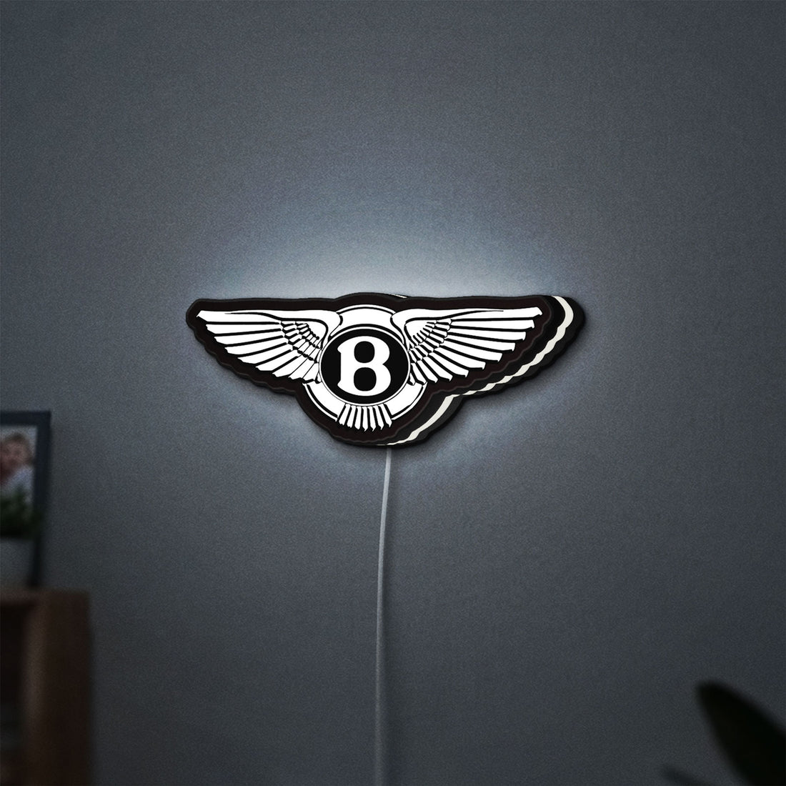 Bentley Motors LED lightbox hanging on a wall with white glow