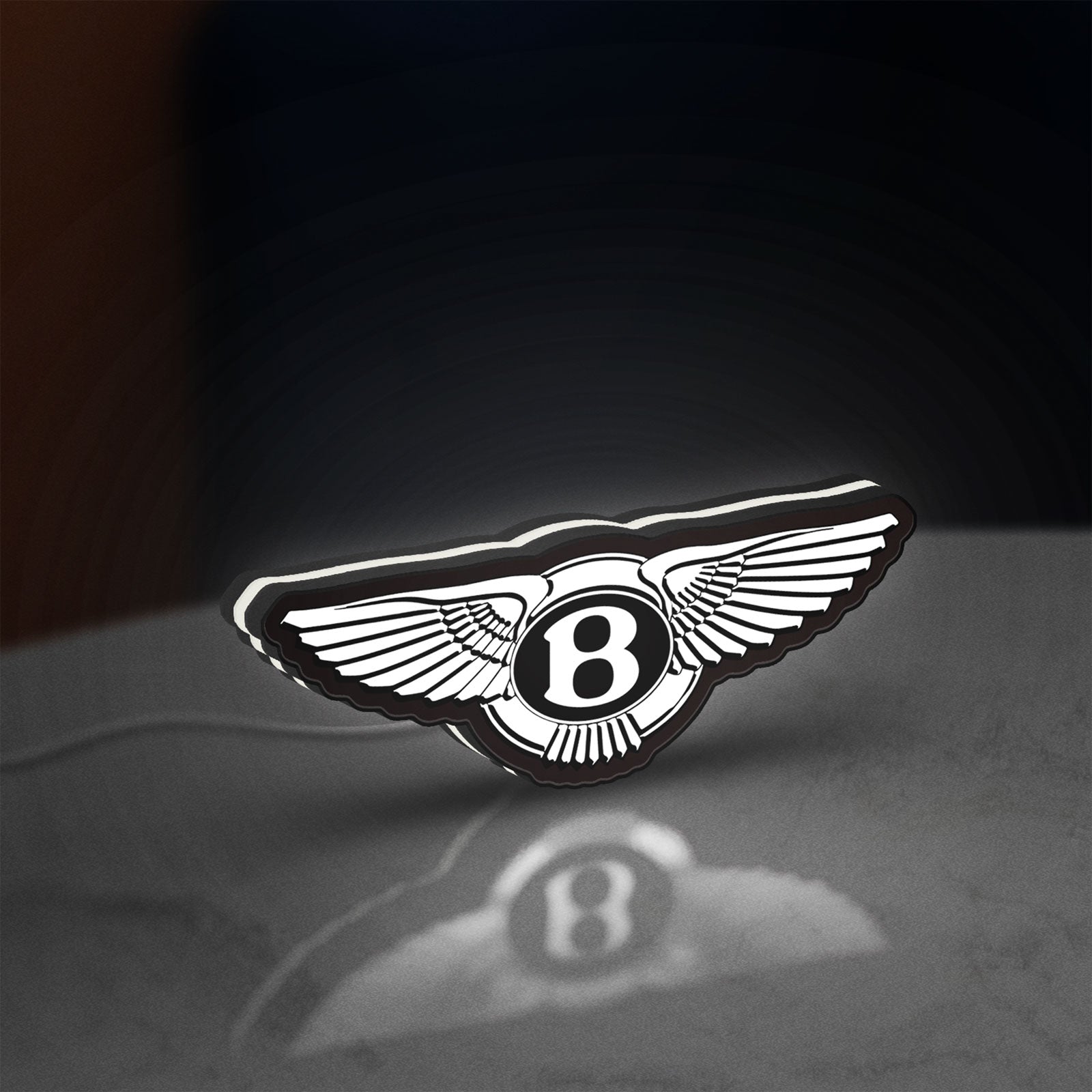 Bentley Motors LED lightbox standing on a desk from an angled side view with white glow