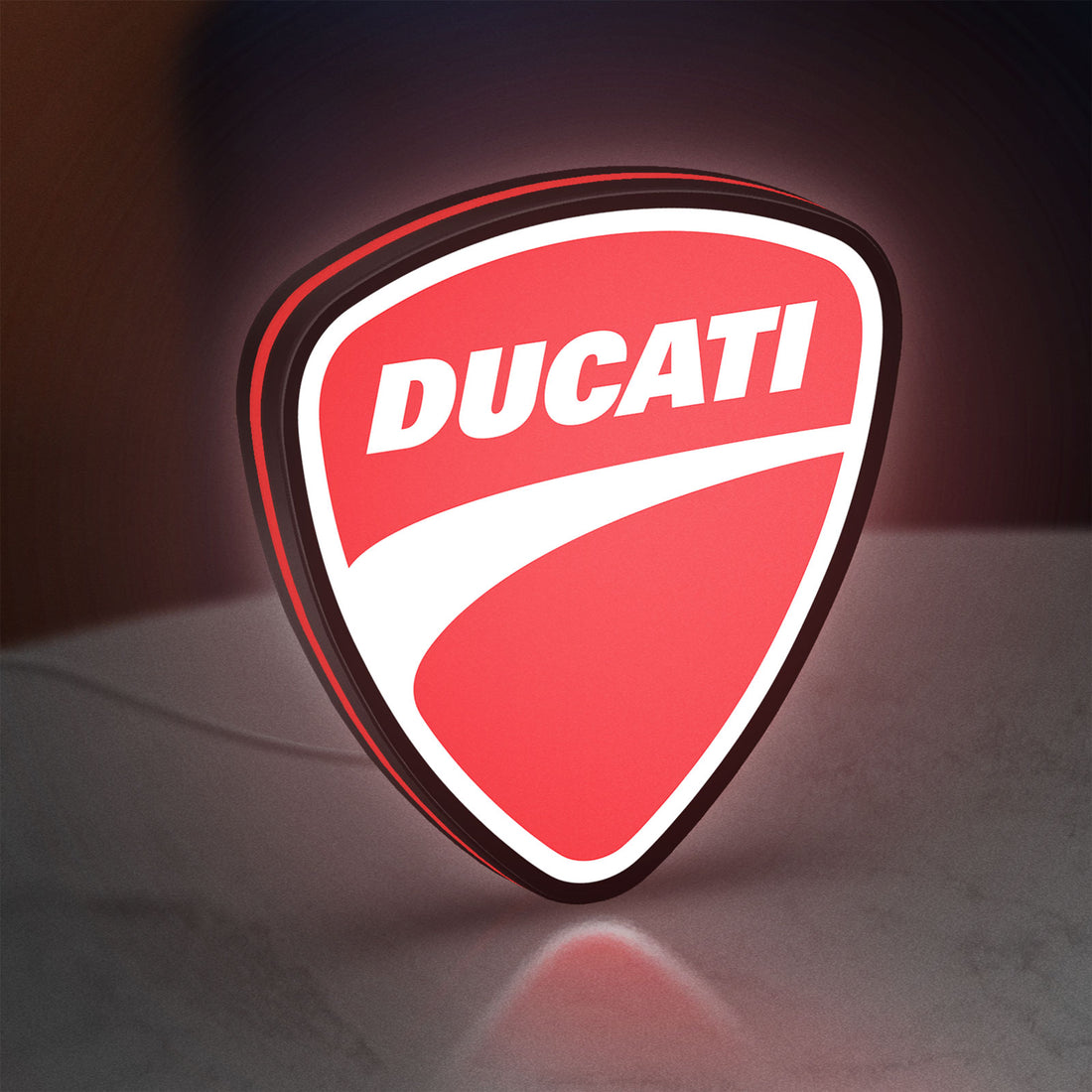 Ducati Sign LED lightbox hanging on a wall with red glow