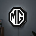 MG Car Logo LED lightbox hanging on a wall with white glow
