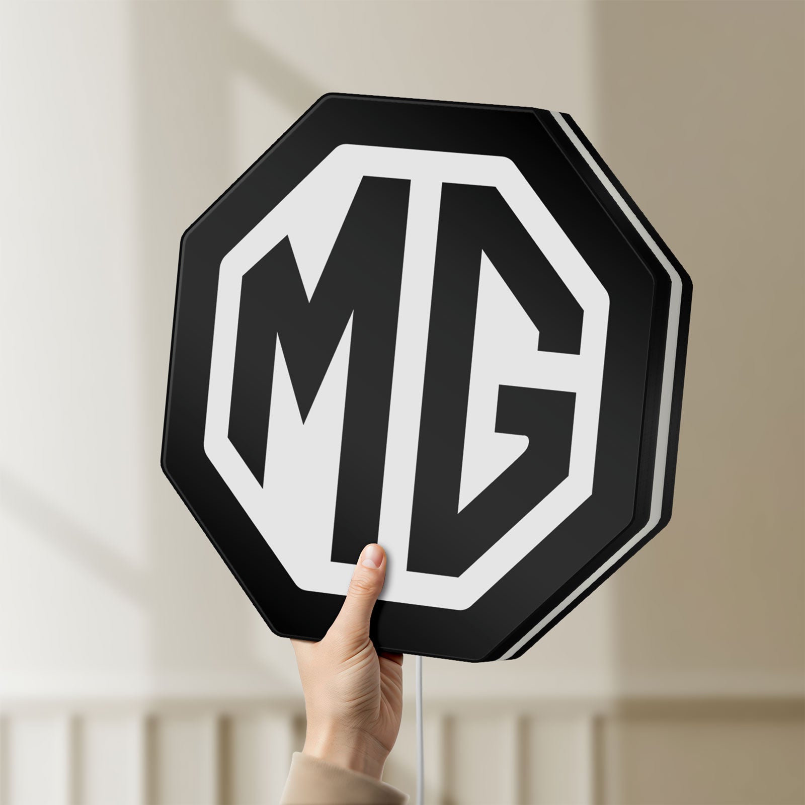 Unlit MG Car Logo LED lightbox held by hand to show size and details