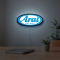 Arai Helmet LED lightbox hanging on a room wall with soft blue light