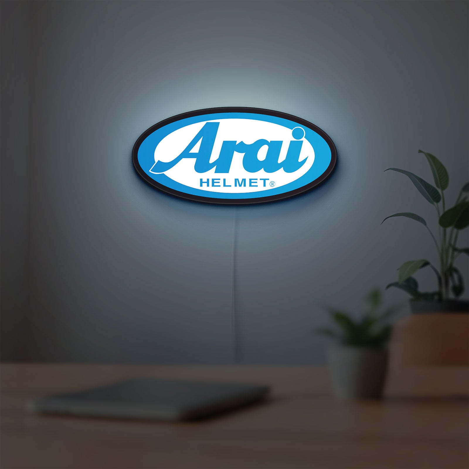Arai Helmet LED lightbox hanging on a room wall with soft blue light