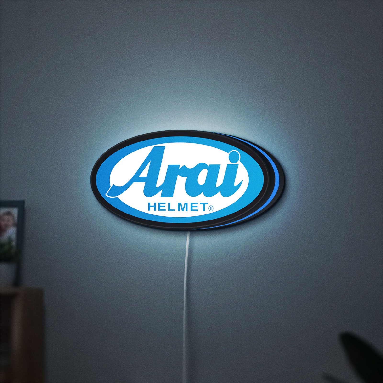 Arai Helmet LED lightbox hanging on a wall with blue glow