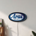 Unlit Arai Helmet LED lightbox mounted on a wall in daylight