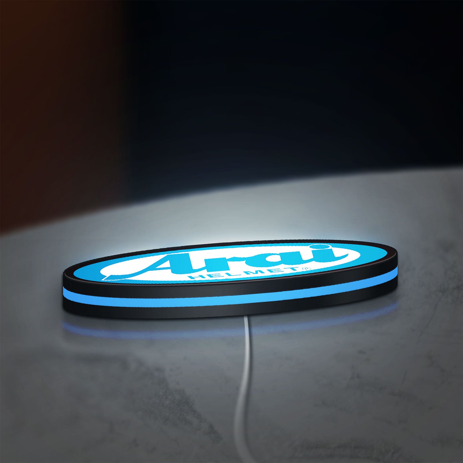 Arai Helmet LED lightbox lying flat on a desk with blue glow