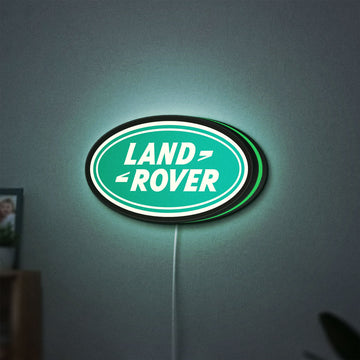 Land Rover LED lightbox hanging on a wall with green glow