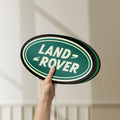 Unlit Land Rover LED lightbox held by hand to show size and details