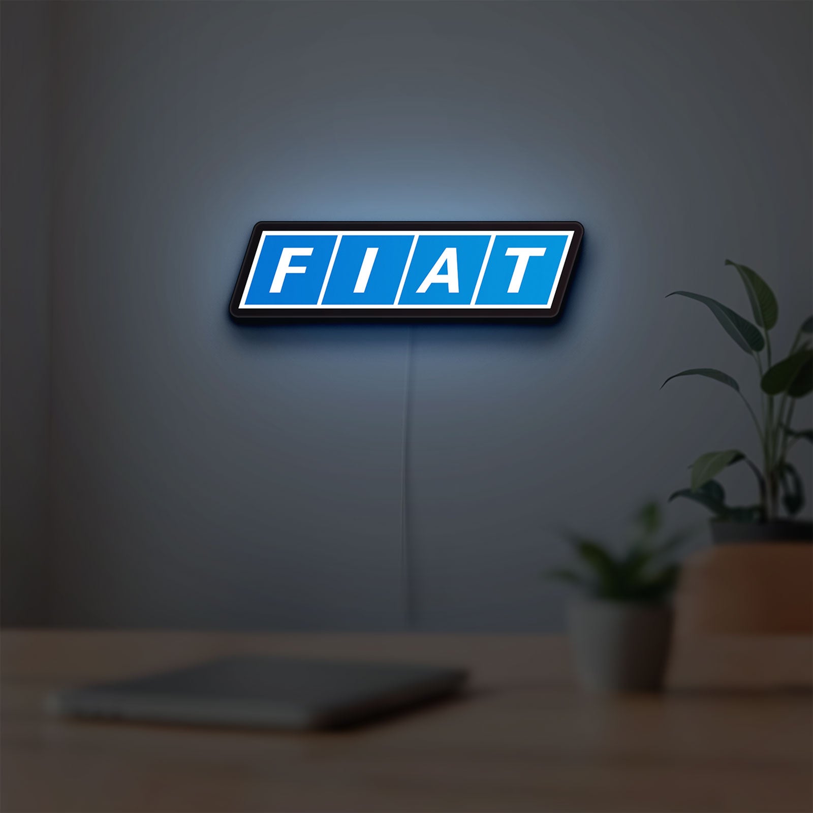 Fiat LED lightbox hanging on a room wall with soft blue light