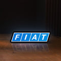 Front view of Fiat LED lightbox sign glowing on a wooden desk