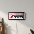 Unlit TRD LED lightbox mounted on a wall in daylight