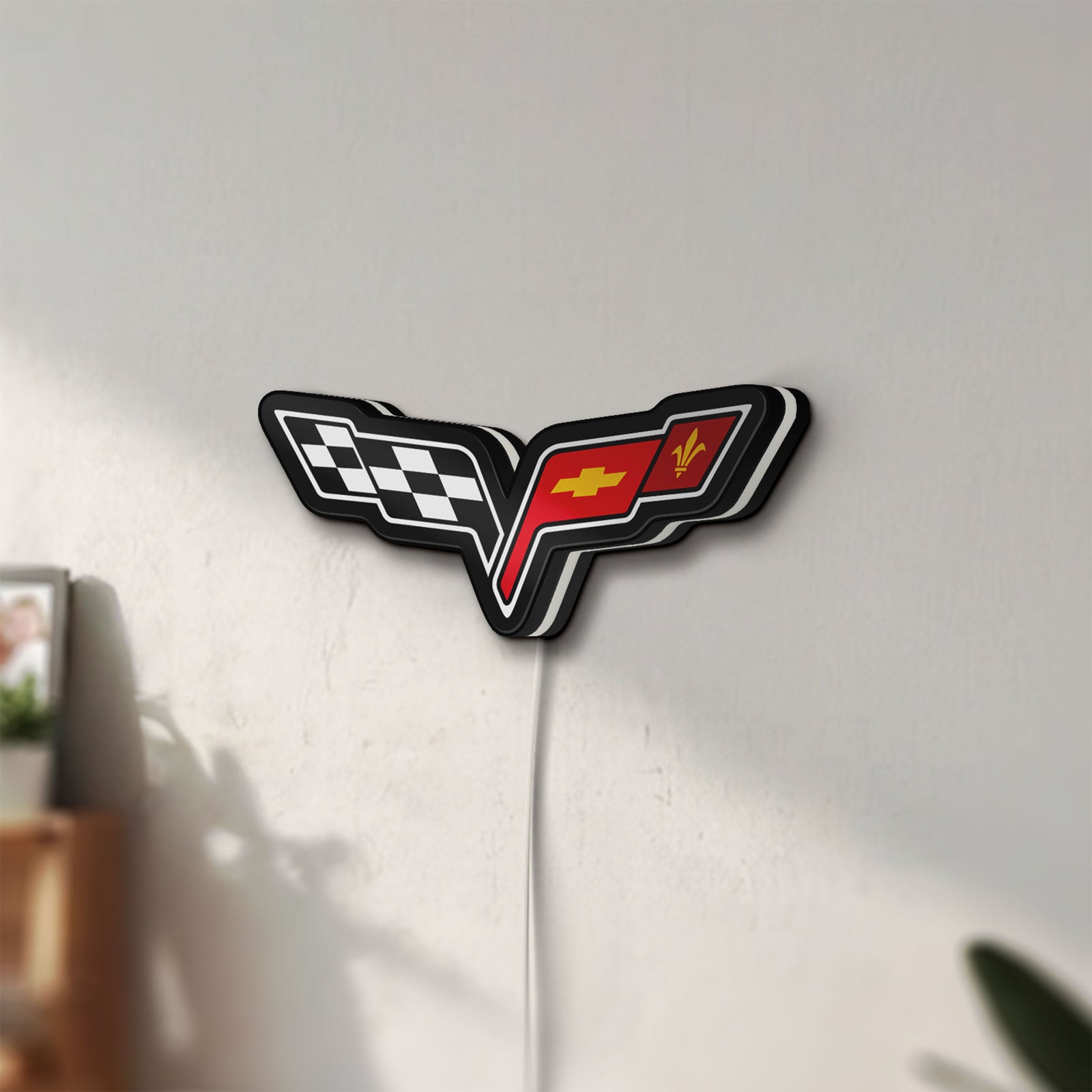 Unlit Corvette C6 LED lightbox mounted on a wall in daylight