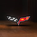 Front view of Corvette C6 LED lightbox sign glowing on a wooden desk
