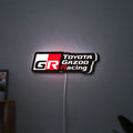 Toyota Gazoo Racing LED lightbox hanging on a wall with white glow