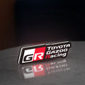 Toyota Gazoo Racing LED lightbox standing on a desk from an angled side view with white glow